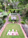 Landscaped garden of various plants, trees, and bushes and steps