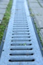 Rainwater drainage canal or tray with metall mesh capor grate