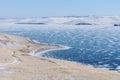 Landscape of winter island and frozen lake at lake Baikal in Siberia, Russia Royalty Free Stock Photo