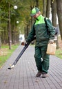 Landscaper cleaning the track using Leaf Blower Royalty Free Stock Photo