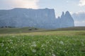 Landscapes on Alpe di Siusi with Schlern Mountain Group in Background and small cabins on the grassland in Summer during the sunse Royalty Free Stock Photo