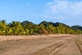 Boquita beach with its palm trees and mountains.