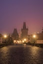 Landscapes on Charles Bridge with Bridge Tower and Statues at sunrise in a foggy morning, Prague, Czech Republic, Europe Royalty Free Stock Photo