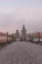 Landscapes on Charles Bridge with Bridge Tower and Statues at sunrise in a foggy morning, Prague, Czech Republic, Europe Royalty Free Stock Photo