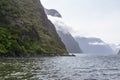 Landscapes of FjordLand. Snowy mountains in the clouds. New Zealand