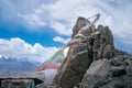 Landscapes of India country with the most dangerous road on the world. Tibetan flags with blue sky. Mountains during a sunset or s Royalty Free Stock Photo