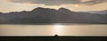 Lonely yurt on the lake, sunset light