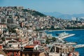 Landscapes of Naples; the coast of the city with houses on the mountain and with boats in the sea Royalty Free Stock Photo