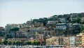 Landscapes of Naples; view from the shore of the houses of local residents behind which is therport Royalty Free Stock Photo