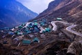 Landscapes of Nathang Valley, East Sikkim, India. Mesmerizing view of a small village under clouds and zig-zag road. Royalty Free Stock Photo