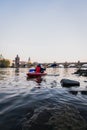 Landscapes of Vltava River and Charles Bridge in Prague, Czech, with an Asian women kayaking on the river