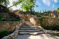 Landscaping. Decorative stone steps down the hill