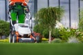 Landscaping Garden Keeping Worker Mowing Back Yard Lawn