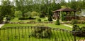 Landscaping panorama of home garden. Scenery of natural area in summer. Landscape design with stones and plants at residential Royalty Free Stock Photo