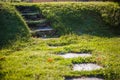 Landscaping on the site - green lawn with stone steps. Royalty Free Stock Photo