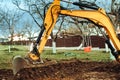 Landscaping works with bulldozer and excavator at home construction site. Terrain works, construction site, industrial details