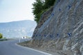 Landslide and rock sliding prevention in Georgia, reinforcing mountain slope with metal mesh. Royalty Free Stock Photo