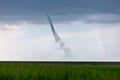 Landspout tornado over a farm field