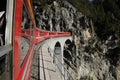 The RhÃÂ¤tische railway on its way through the swiss alps