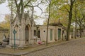 Lane with old grave monuments in in Mont martre cemetery, Paris, France, Royalty Free Stock Photo