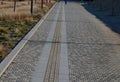 lane in paving forblind. the protrusions on tiles guide the foot to the