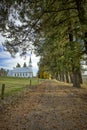 Lane and trees lead to country church
