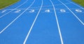 Lanes of a athletic track with numbers one two three four five s Royalty Free Stock Photo