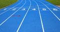 lanes of a athletic track with numbers one two three four five s Royalty Free Stock Photo