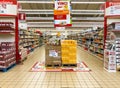 Lanes of shelves with goods products inside of the IPER of Varese hypermarket. Breakfast department with bread and flour counter i