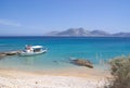 Greece, Koufonissi. A solitary small fishing boat at anchor. Royalty Free Stock Photo