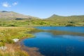 Idyllic mountain landscape, lake gader, Snowdonia national park. Calm peaceful waters with distant hills.