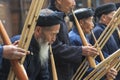 Miao men playing a traditional flute in Langde Miao village, Guizhou province, China