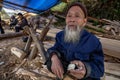 Langde Shang Miao Village, Old chinese man eating chicken egg.