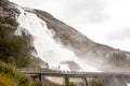 Langfoss waterfall in Norway during rainy weather