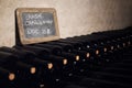 Langhe chardonnay bottles aging in a cellar