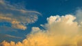 Blue sky with white and yellow clouds background