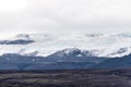 Langjoekull glacier behind of black lava field in Iceland Royalty Free Stock Photo