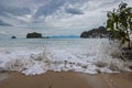 Langkawi Beach of Pantai Tanjung Rhu on the malaysia island Langkawi. Clouds over the bay. Wave splash on the sandy beach. Rocks Royalty Free Stock Photo