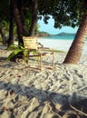 Langkawi Island. Chair & Book between Palm Trees Royalty Free Stock Photo