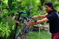 Asian man are washing road bicycle
