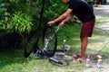Asian man are washing road bicycle near by home