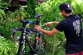 Asian man are washing road bicycle near by home