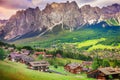 Langkofel and alpine village, Dolomites sudtirol near Cortina d Ampezzo Royalty Free Stock Photo