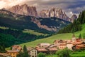 Langkofel and alpine village, Dolomites sudtirol near Cortina d Ampezzo Royalty Free Stock Photo