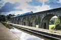 Langollen Canal at Chirk Train Passes on Viaduct Royalty Free Stock Photo