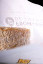 A Langres cheese with original wrapping paper Royalty Free Stock Photo