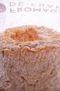 A Langres cheese with original wrapping paper Royalty Free Stock Photo