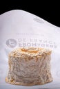 A Langres cheese with original wrapping paper Royalty Free Stock Photo