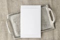 Lank white paper postcard on retro silver metallic tray on beige linen rustic table cloth