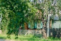 lanscape photo of an abandoned house on in the countryside, surround by lush, green trees, Rustic , surrounded Royalty Free Stock Photo